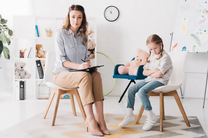 Woman and child in a counseling session.