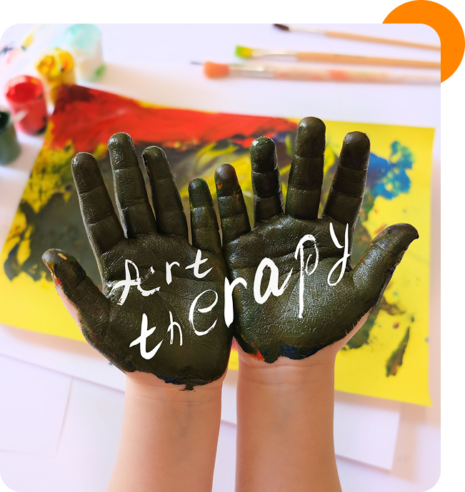 Hands with paint, "Art Therapy" written.